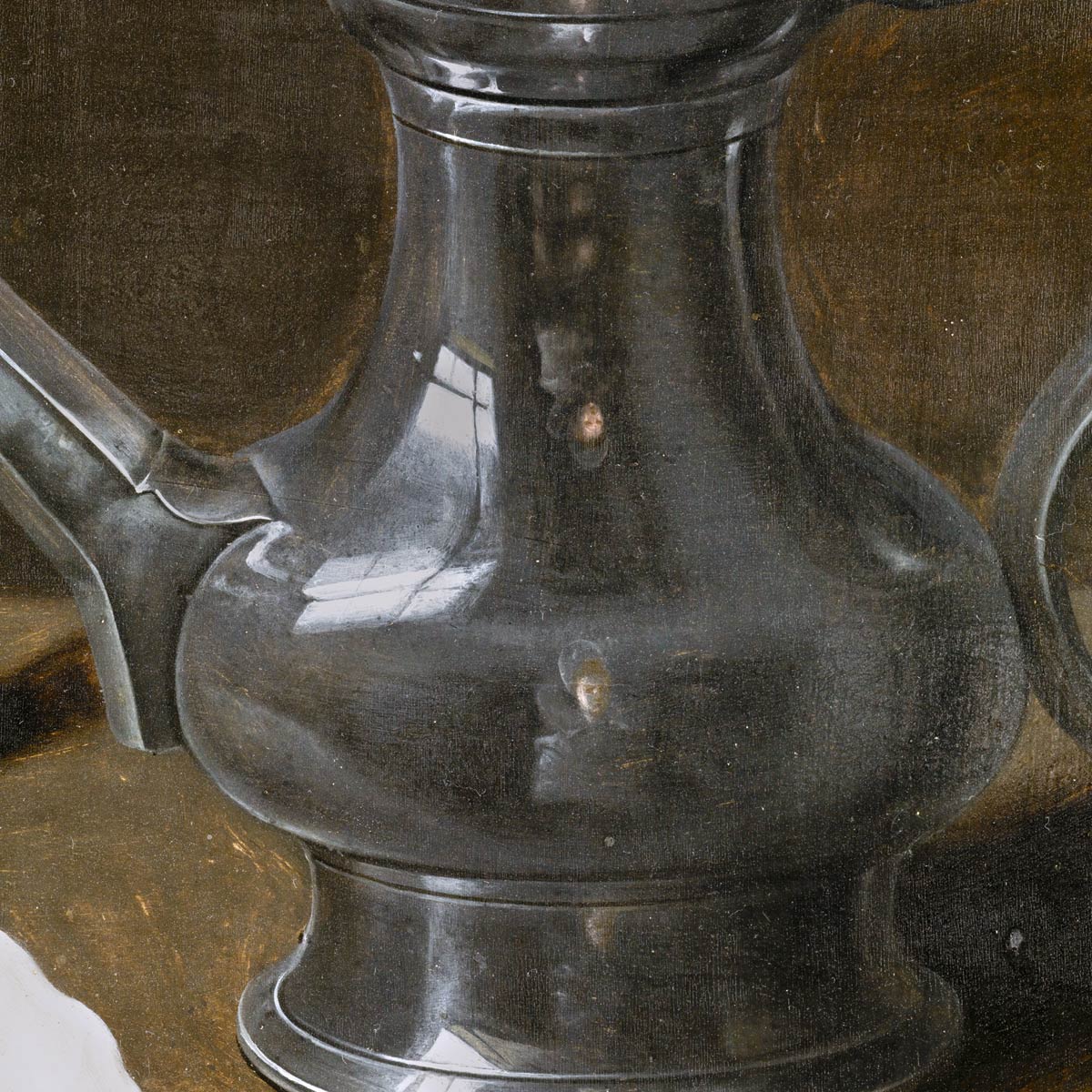Clara Peeters no pudo formarse en las academias (impensable para una mujer), pero se reivindicó, se mostró sin dejarse ver, retratándose en el reflejo de objetos de sus bodegones. Esos autorretratos diminutos eran un alarde de destreza que también practicó Jan van Eyck. Esta es la imagen más nítida que hay de su cara. Es una ampliación de su reflejo en la jarra de uno de sus bodegones.